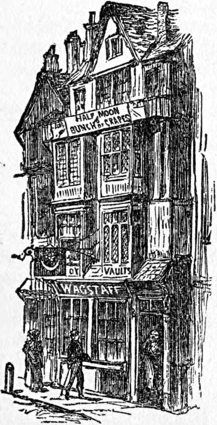 The tall, narrow front of an old London house hung with shop signs, with figures at its door below.