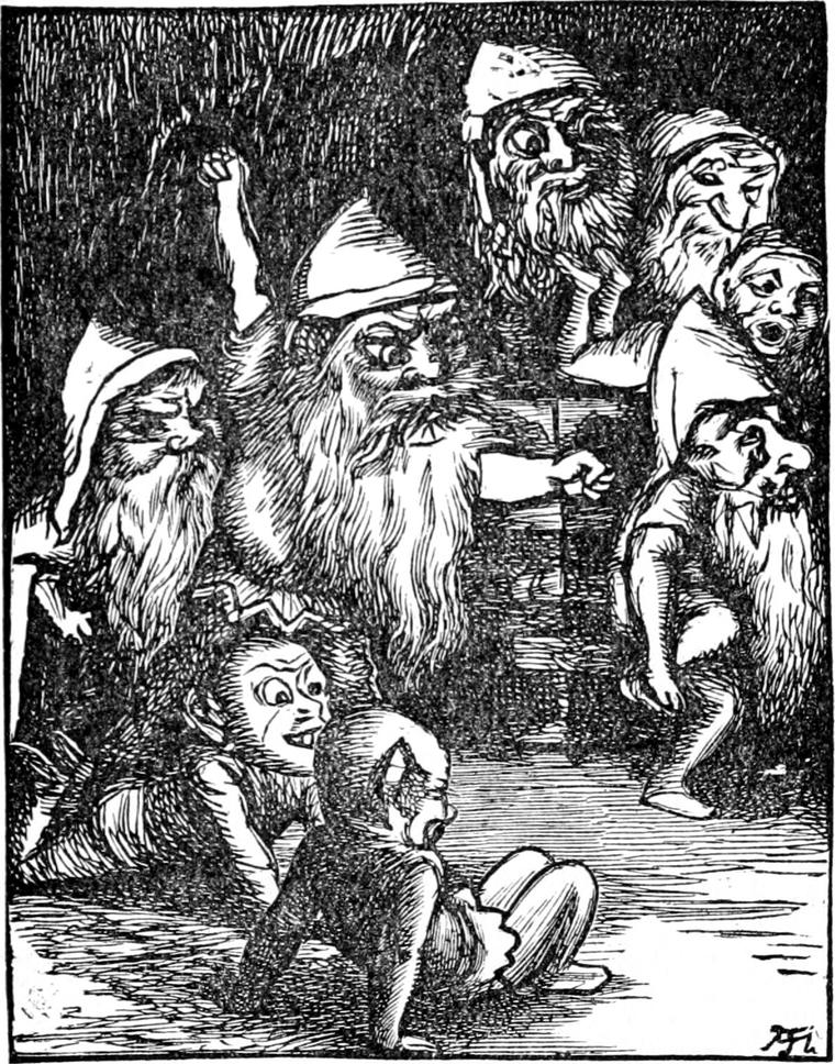 A bearded goblin points and gives orders among his grotesque family in their cave, with young goblins sprawling and gaping on the floor.